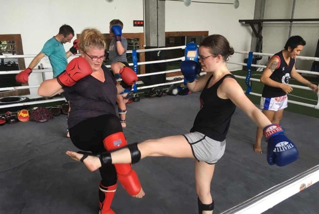 CMLocals Chiang Mai Locals Muay Thai ED Visa two women sparring in ring training